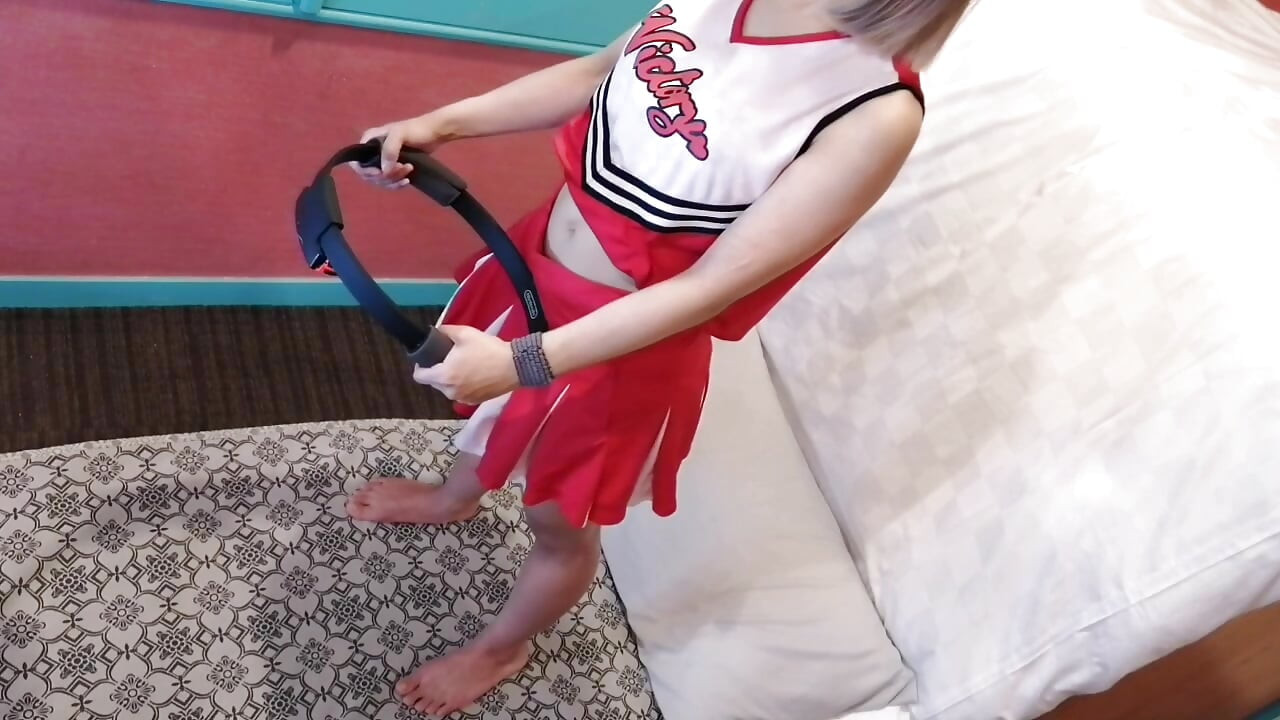 A cute, busty married woman performs exercise 4 in an erotic cheerleader costume. Peeking down from above. Home made amateur Private Shoot