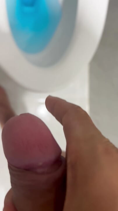 The young man escaped into the bathroom to relieve his needs.