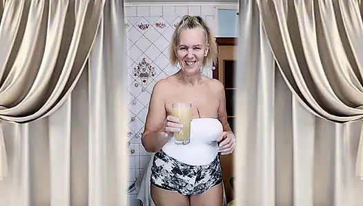 Housewife Lukerya warms up in the kitchen and flirts playfully on webcam.