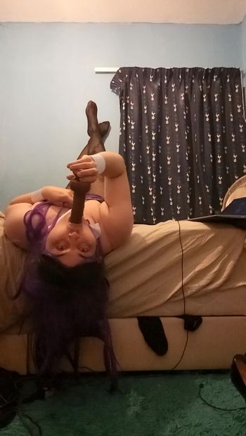 Aimee takes her dildo over the bed like a slut