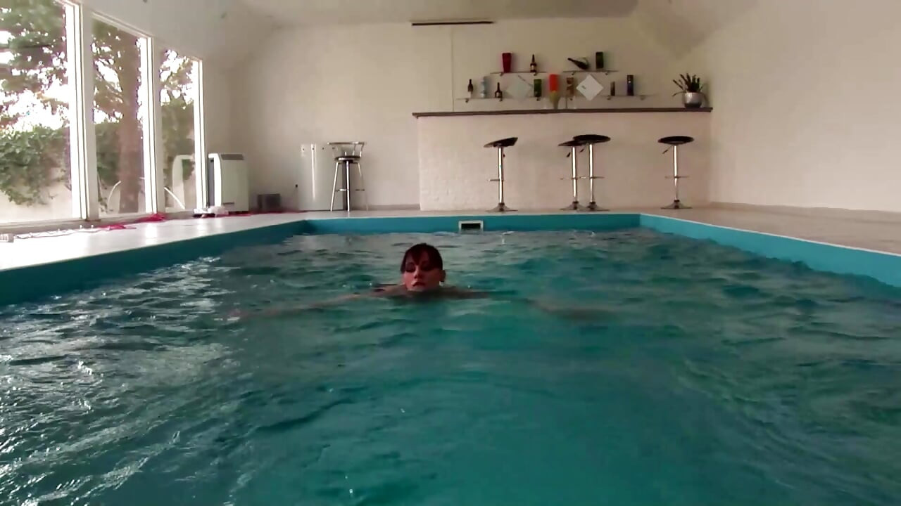Two lesbians enjoy masturbation and fisting by the pool