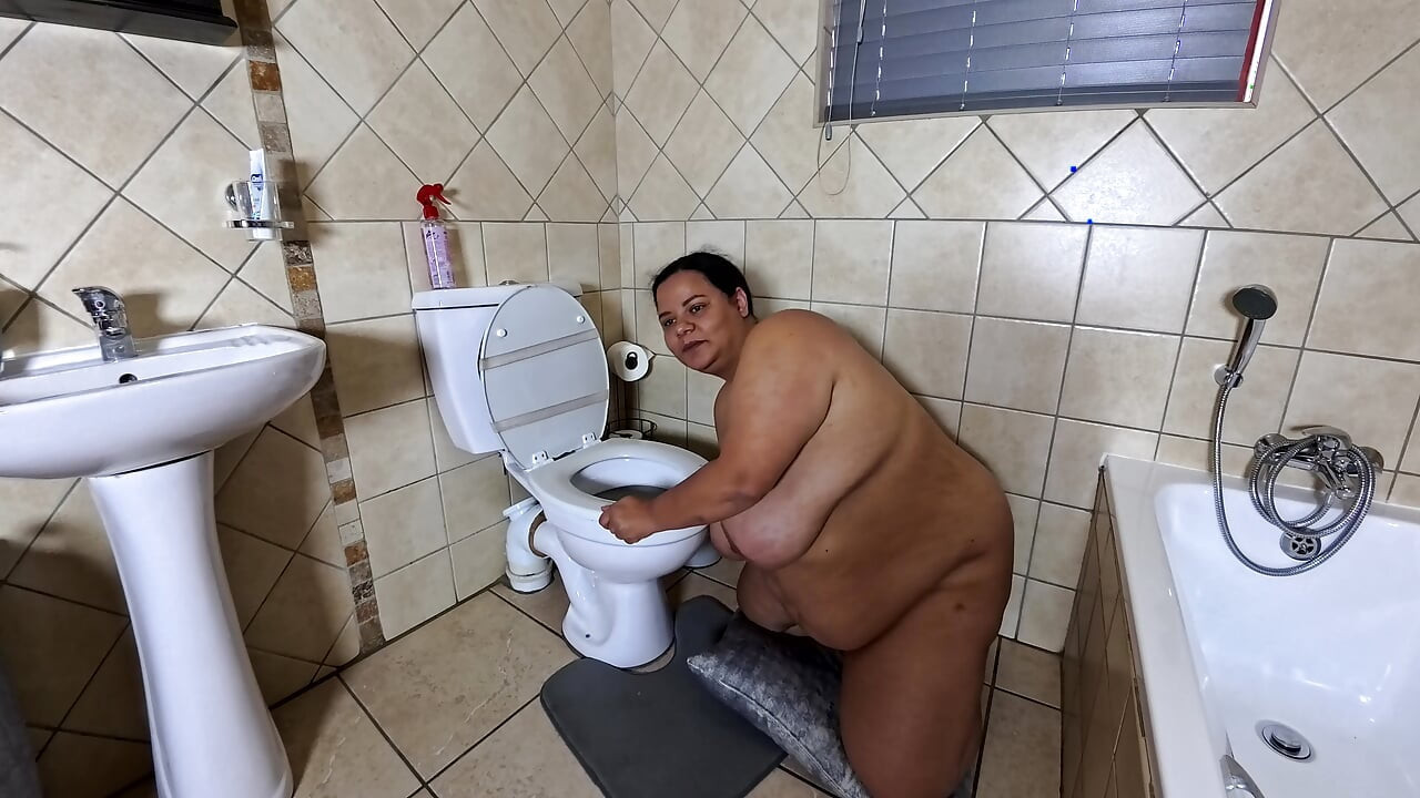 Playing with my fat pussy while licking the toilet