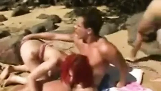 Outdoor threesome on a beach