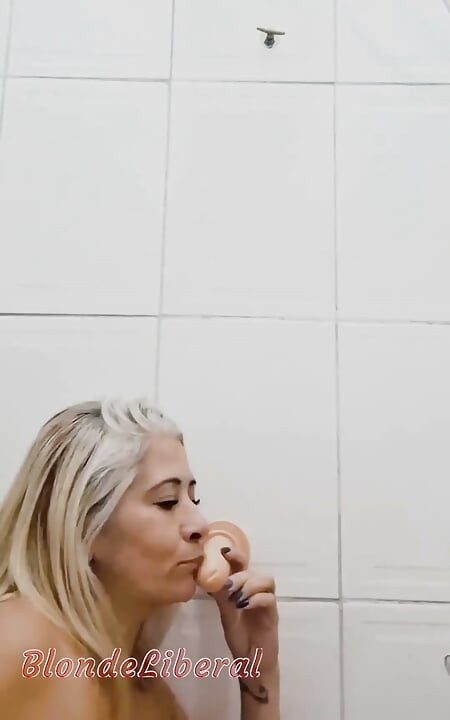 In the Bathroom, Sticking Dildo in Her Pussy