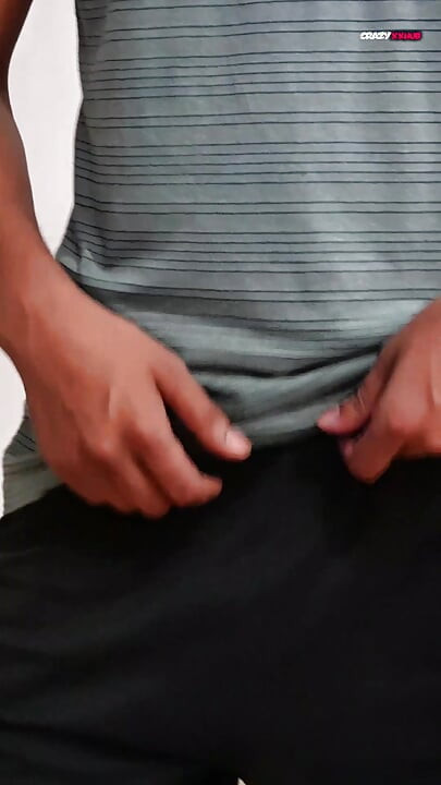 A sexy guy is dancing while holding his cock.