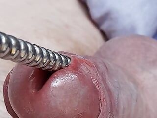 Sounding with a close up cum load through penis plug