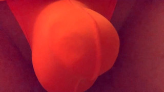 Playing in a orange thong