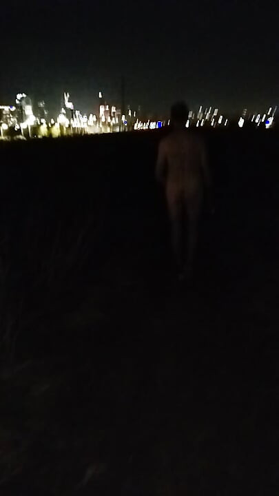 Naked walking on the hill along highway