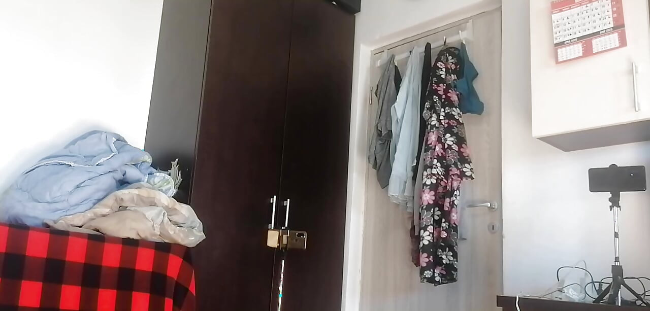 Amateur woman has fun trying on clothes and cutting them. Amateur woman vacuums naked in the house.