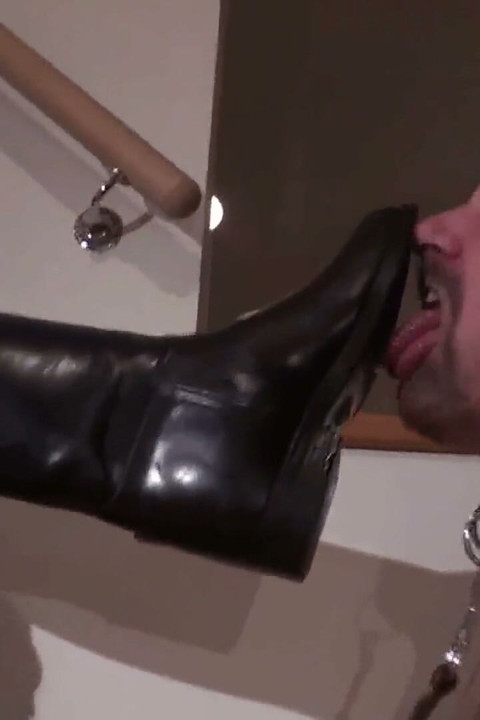 Boot cleaning by her mature slave