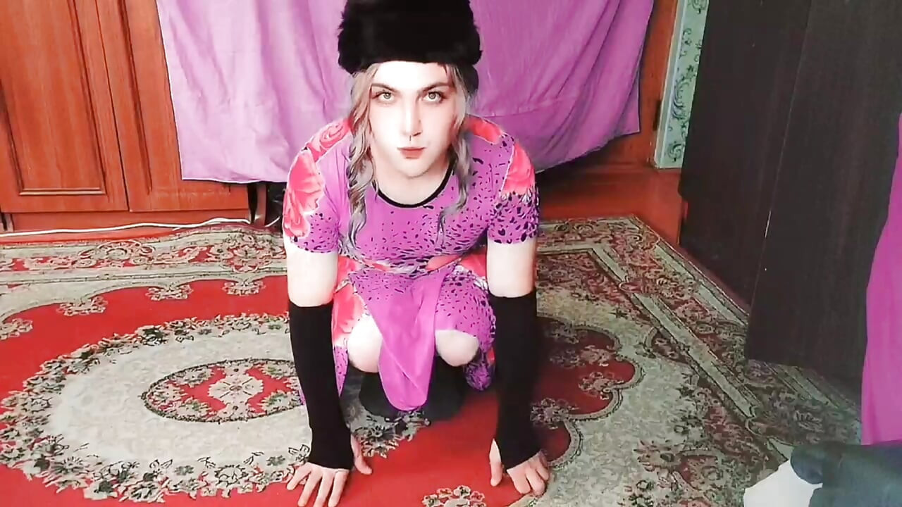 Stunning femboy leaning on wall with crossed legs