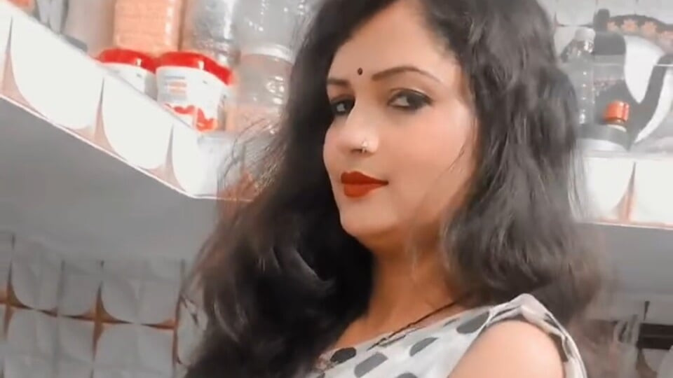 Tina Nandy and Tejaswini Prabhakar whispering in the dark