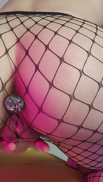 Playing with my buttplug in fishnets