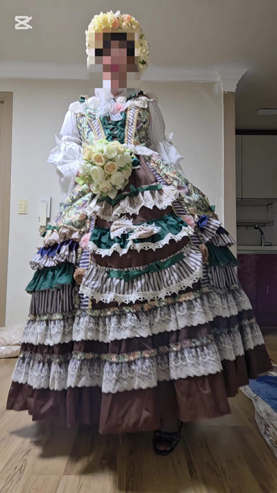 A crossdressing man is wearing a dress and dancing.