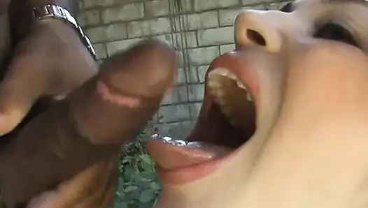 Teen deep-throating black cock outdoor
