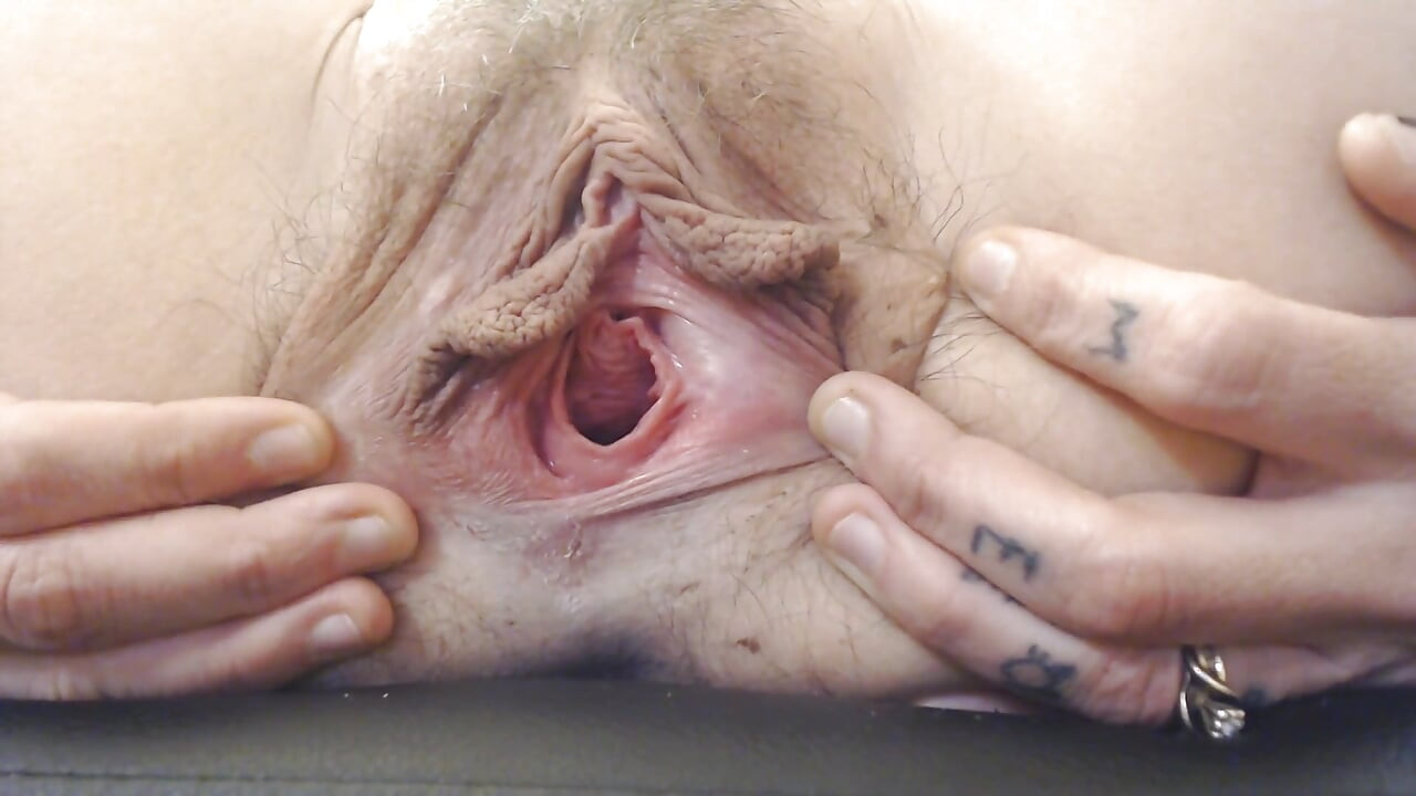 Gaping pussy lip spreading