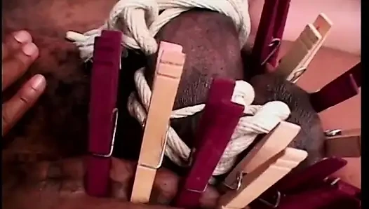 Mistress Lena Ramon and her affiliate use rope and clothespins to tame the giant black snake of Mr. Eighteen