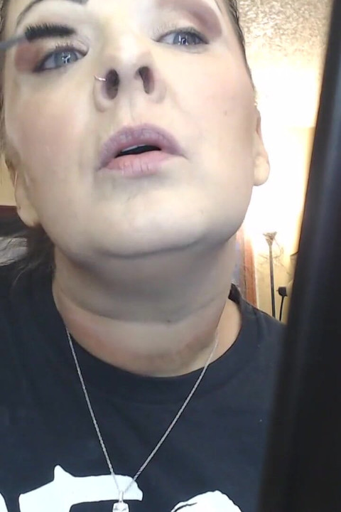 Doing make up dangling smoke