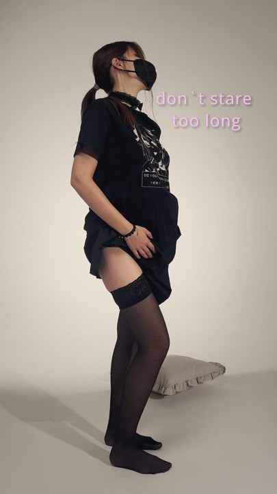 Faceless masked girl lifting black miniskirt – slow tease
