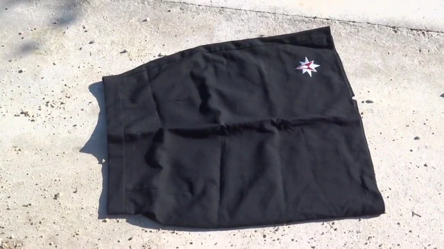 cleaning shoes on black skirt
