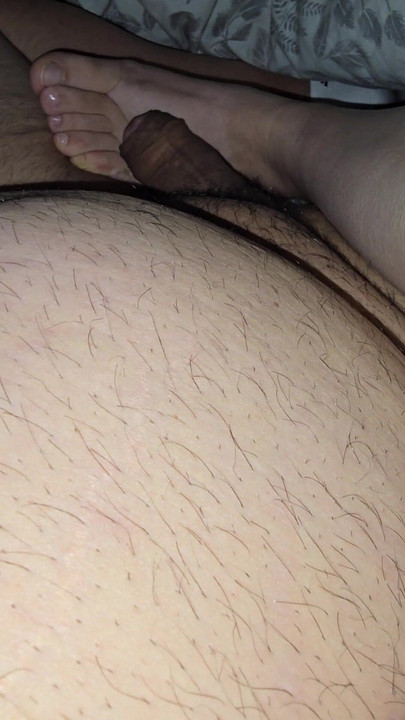 Step mom lets step son fuck her feet while sitting in bed | Clip 1