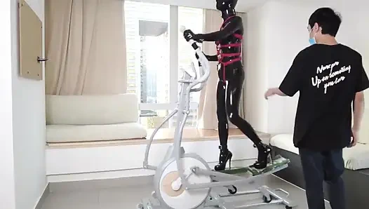 Mz27 - a Girl Bound in Latex Walks on a Treadmill