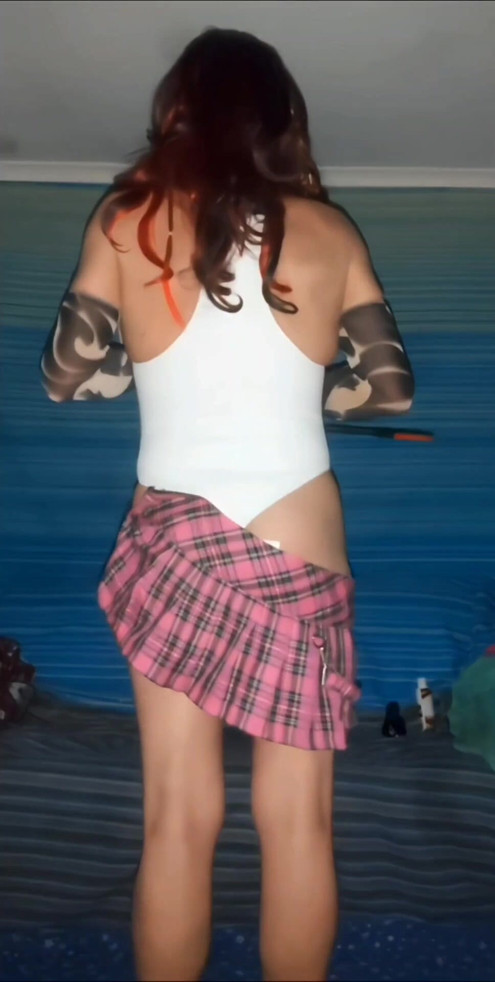 Sliding off my tartan mini to spank myself in white swimsuit