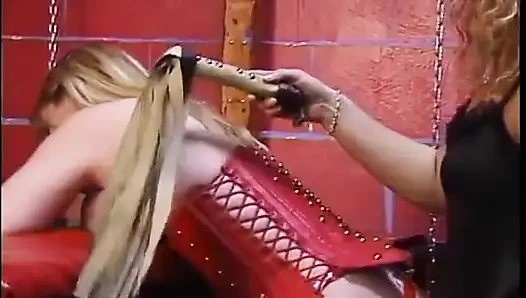 Blonde with huge bruised tits is teased by female temptresses in bondage dungeon