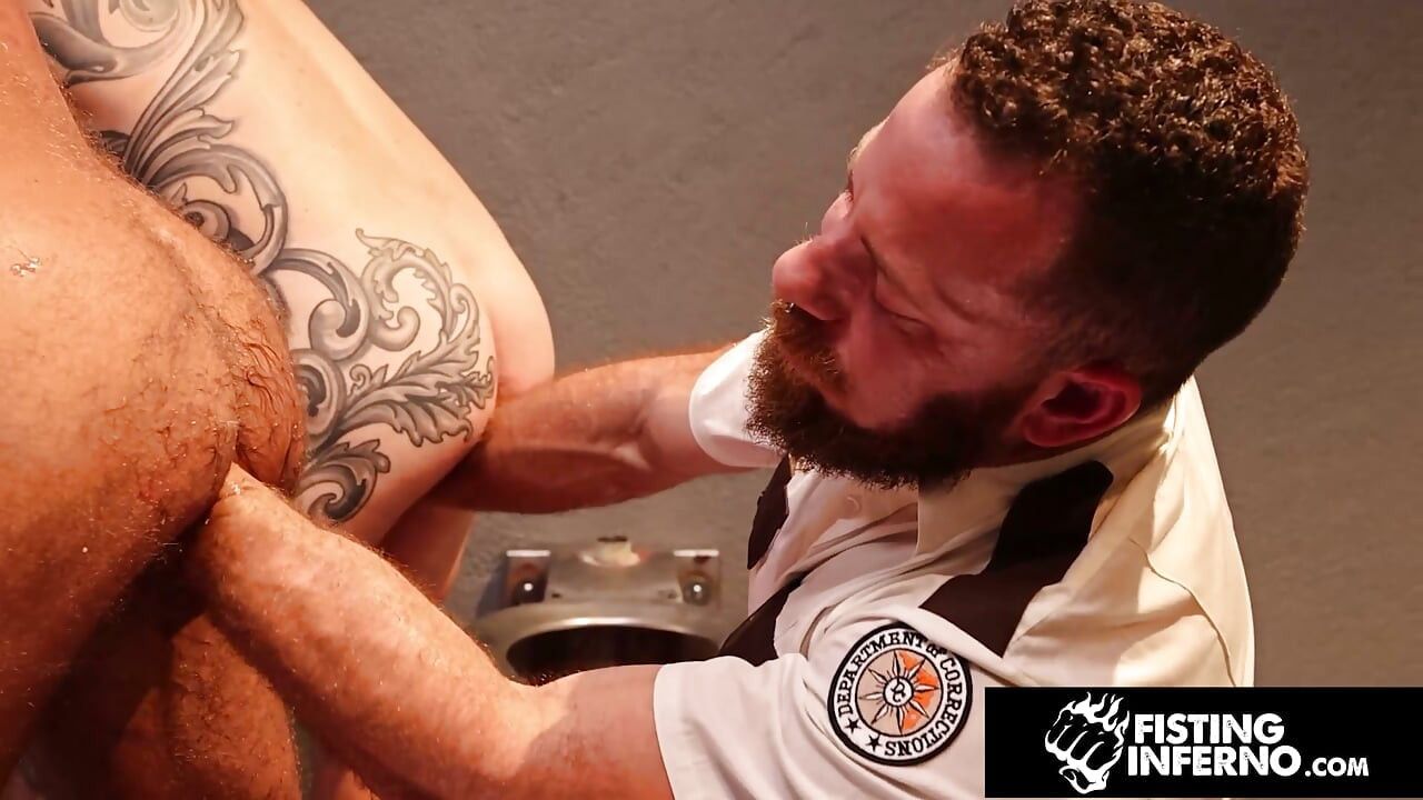 FISTING INFERNO - Beefy Copper Restrains & Fucks Inked Up Inmates