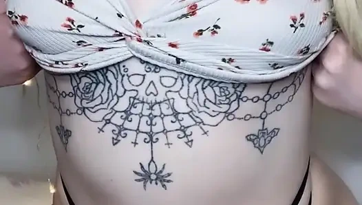 amateur tattooed blonde oils her pierced tits