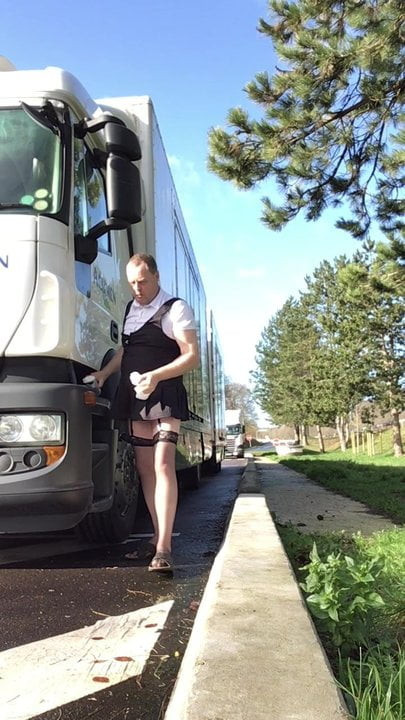 SISSY CLEANING A TRUCK MIRRORS