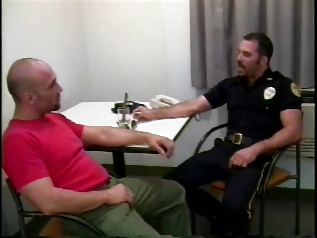 Manly cop fucks a horny gay stud in his office