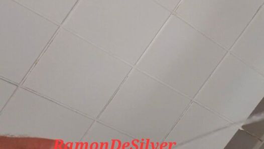 Master Ramon undresses in the dressing room and pisses in the pool shower looking horny in sexy satin shorts