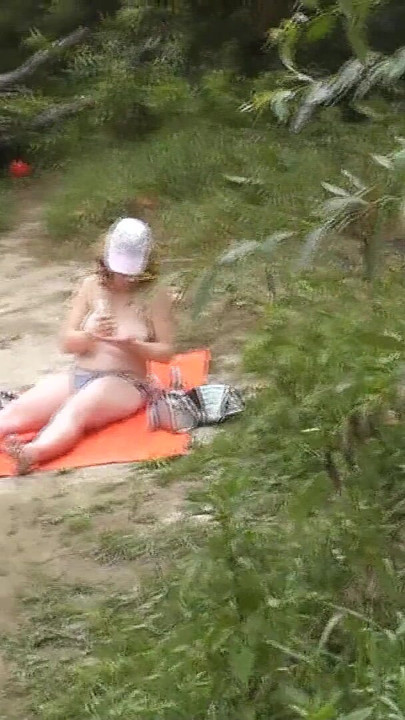 Memorable moment from "Wild beach. Random passerby guy peeps on sunbathing topless beautiful Milf on the river bank"