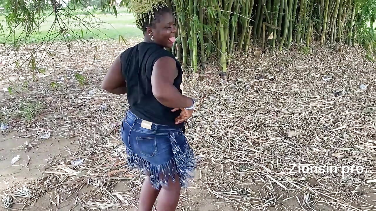 Ebony sexy black girl dances in outdoor with much laughter