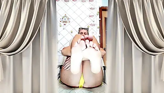 Cheerful Housewife Lukerya Shows Her Bare Feet in Kitchen. Mature Soles and Toes Close Up