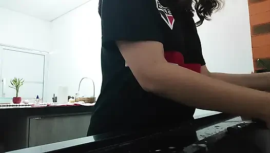 Woman teasing while washing dishes. She loves to transmit to the voyeurs on duty