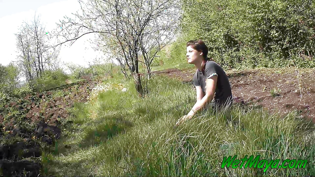 Pissing in grass on the side of the road