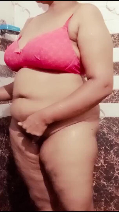 My desi stepmom taking shower in bathroom and I watching her secretly | Clip 1