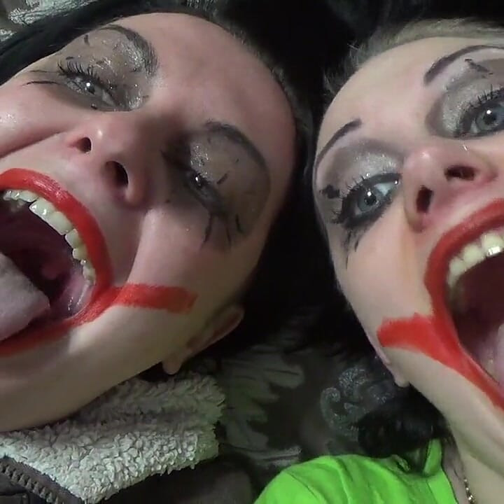 Two crazy clown girls dangle you above their hungry mouths before fighting over who will eat you alive