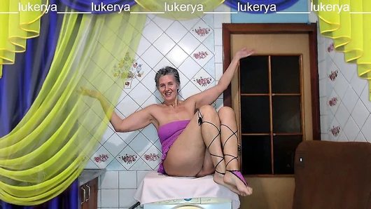 Hot housewife Lukerya loves to create erotic clothes with mesh in different colors, complements the outfit with a leg de