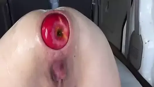 Fisting and fucking her gaping ass with huge apples