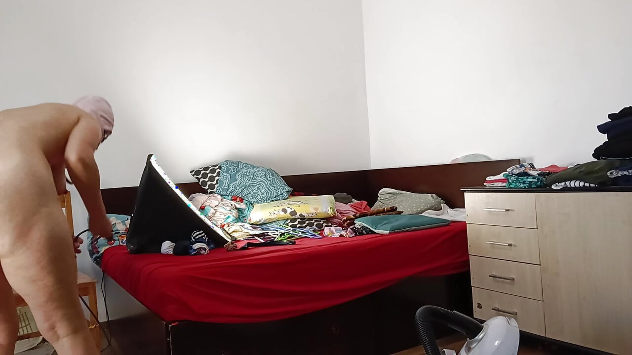 Amateur wife vacuuming in the bedroom. Amateur wife gives me a handjob until I cum.