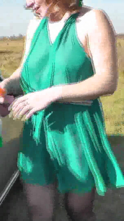 Key moment from "Milf beautiful sexy blonde outdoors on river bank washes car without panties and bra under dress. No"