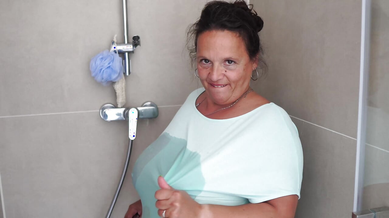Mature Brunette with Massive Tits Gets Steamy in the Shower