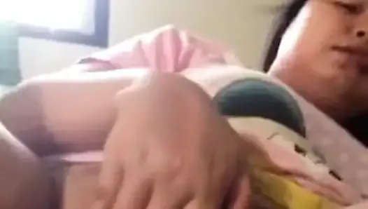Thai slut plays with pussy