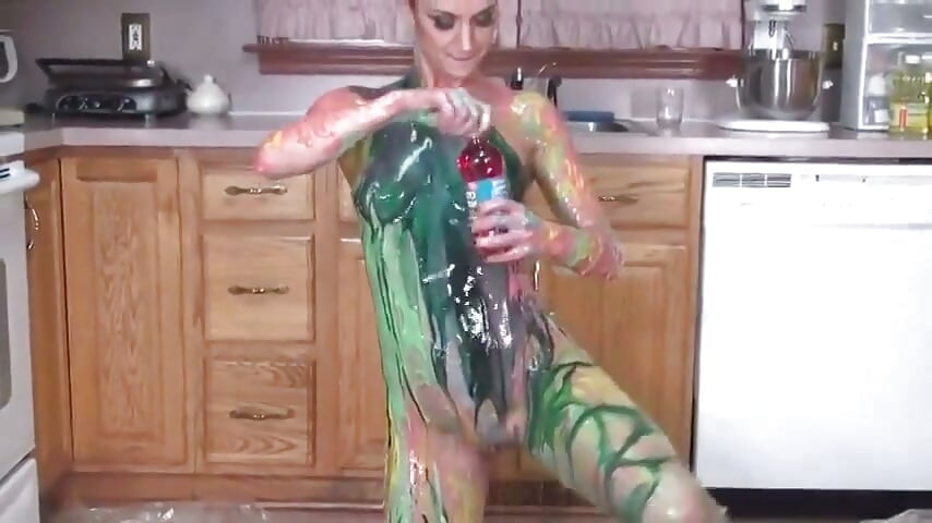 Hot girl puts colors  all on her tits and her pussy in the kitchen