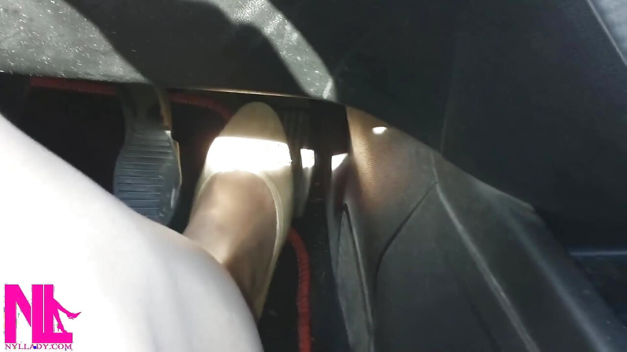 Driving Fast in Beige Pumps on Way to Airport