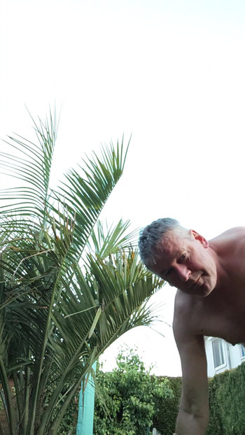 Watering my palm tree nude
