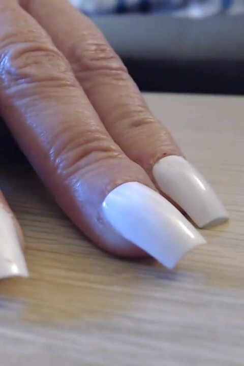 Tapping clicking white fingernails
